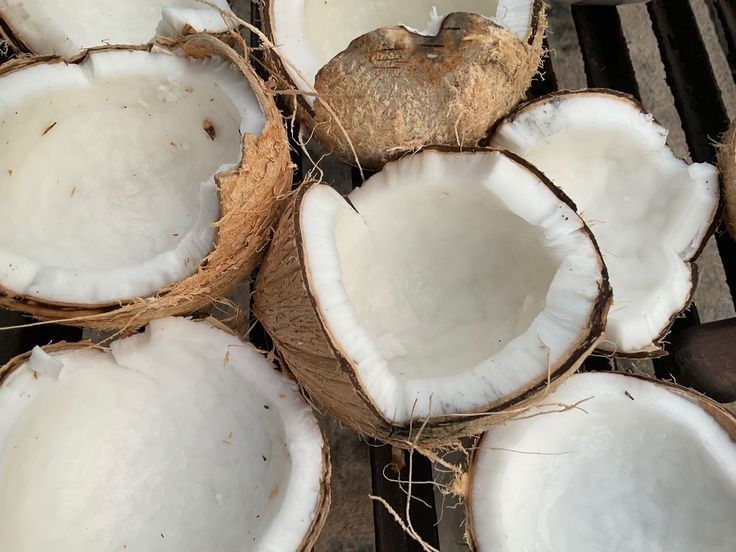 Coconut halves, source of fractionated coconut oil, a hydrating and gentle ingredient for Seborrheic Dermatitis and Eczema care.